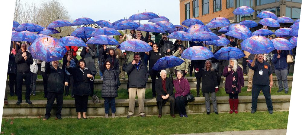 people umbrellas outside